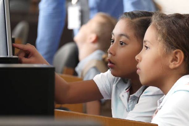 Students Working on a Computer Together